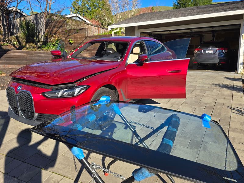 BMW iX windshield prepped on the stand for an Anaheim install